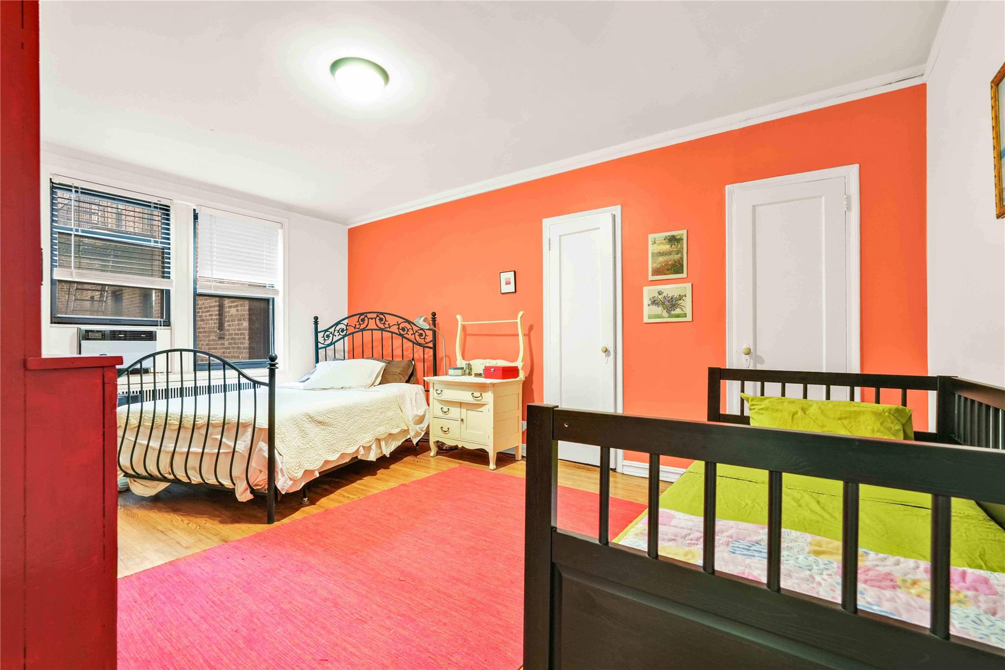 84-51 Beverly Road, Unit 5P Queens, NY 11415 - Photo 13 of 19 Bedroom featuring wood finished floors and crown molding