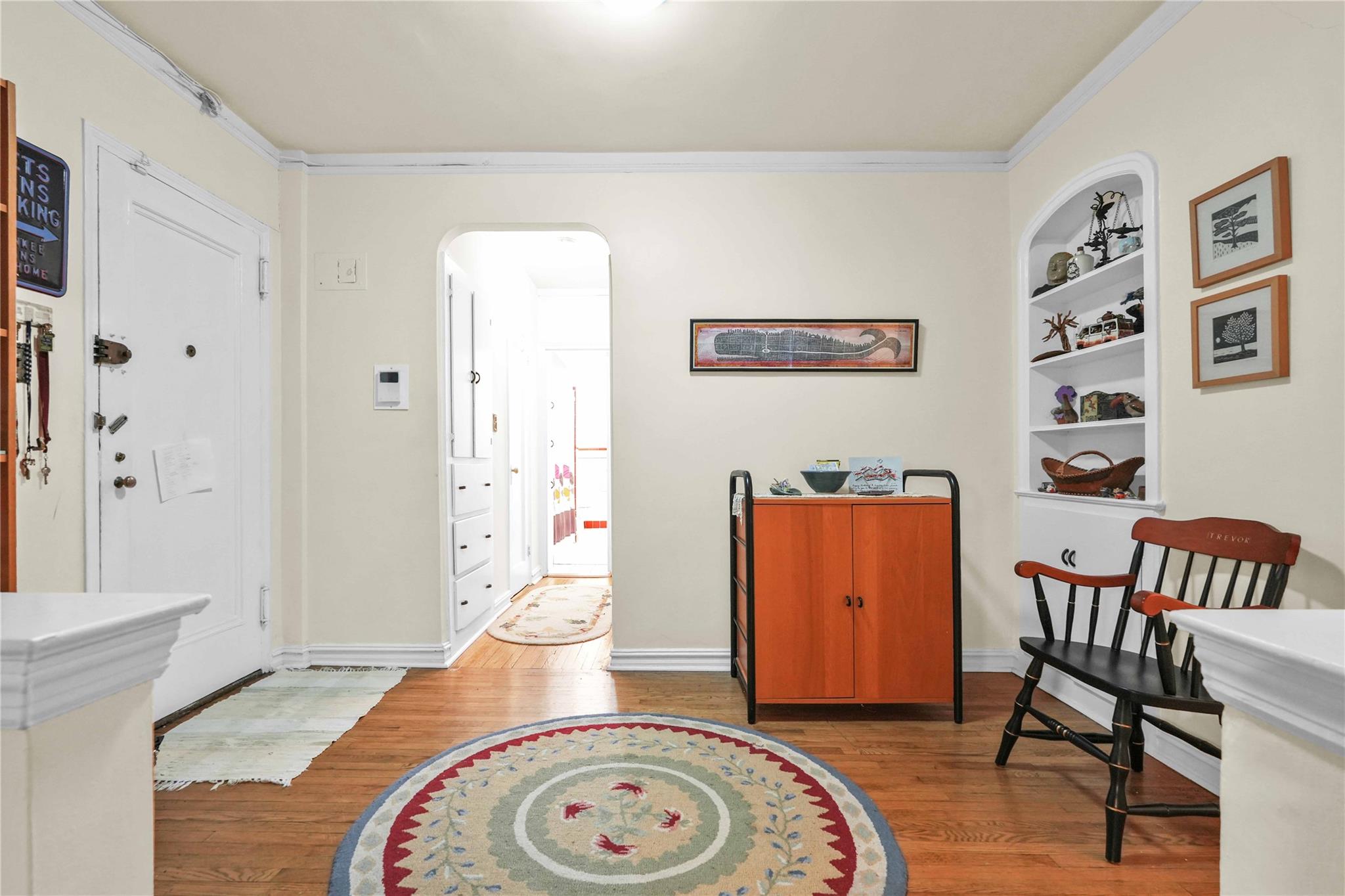 84-51 Beverly Road, Unit 5P Queens, NY 11415 - Photo 4 of 19 Entryway featuring wood finished floors, arched walkways, and ornamental molding