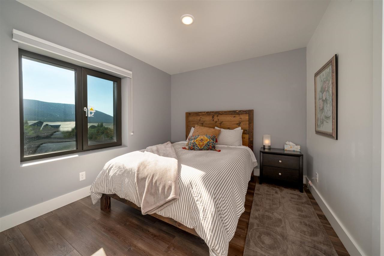 408 Coyote Run Mesa, CO 81643 - Photo 14 of 35 a bedroom with a bed and window