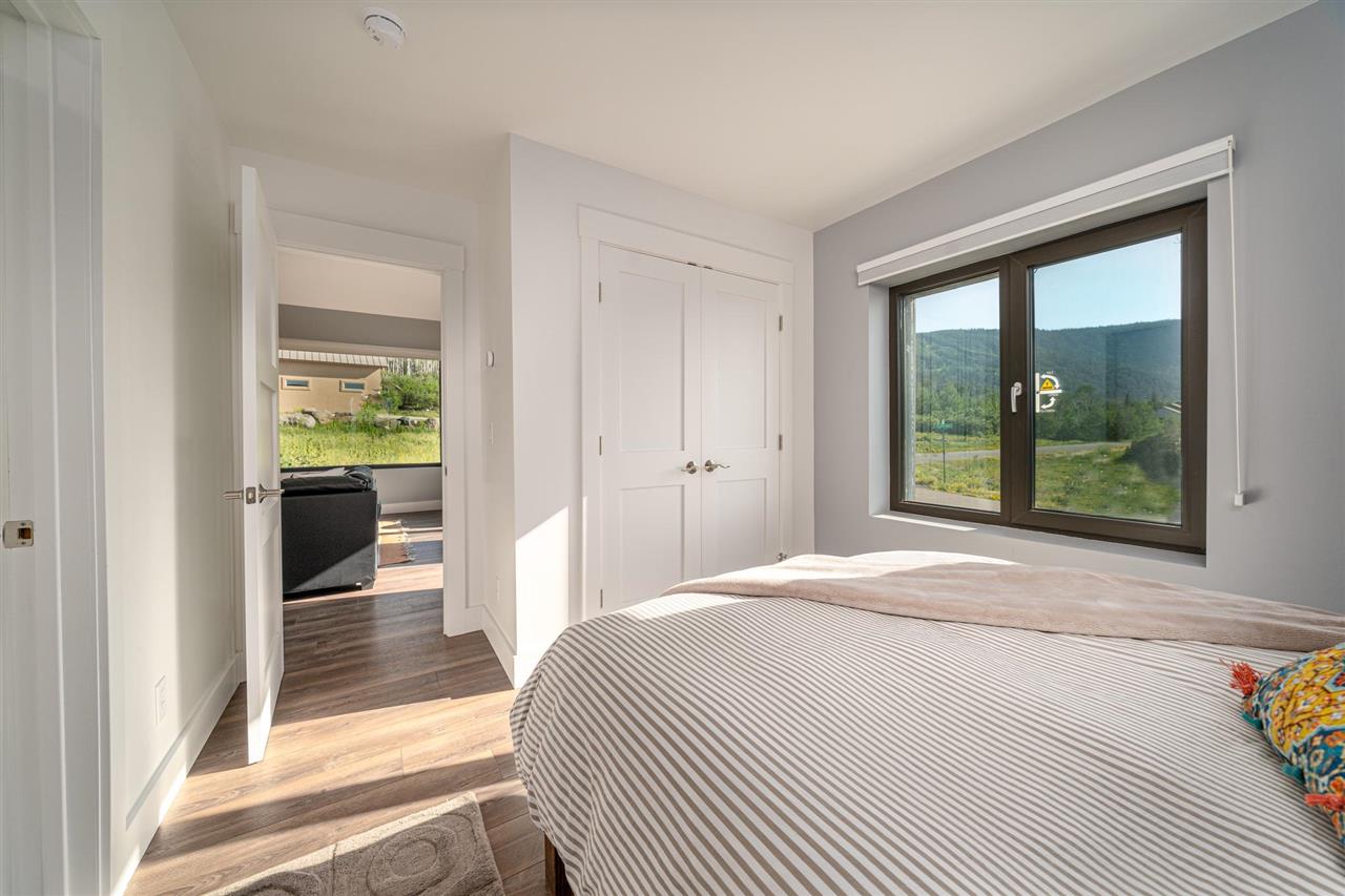 408 Coyote Run Mesa, CO 81643 - Photo 15 of 35 a bedroom with a bed and a window