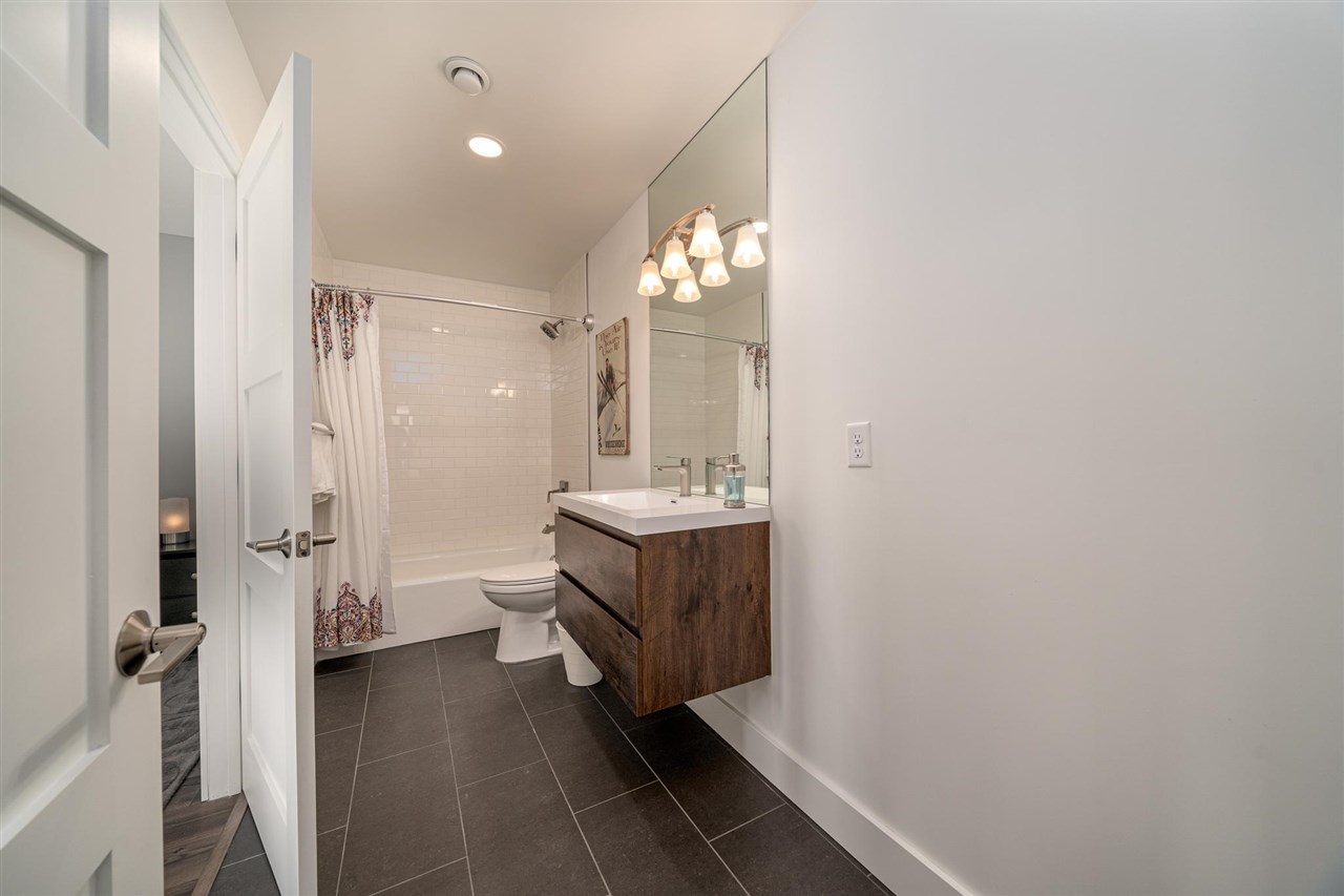 408 Coyote Run Mesa, CO 81643 - Photo 17 of 35 a bathroom with a sink mirror and toilet
