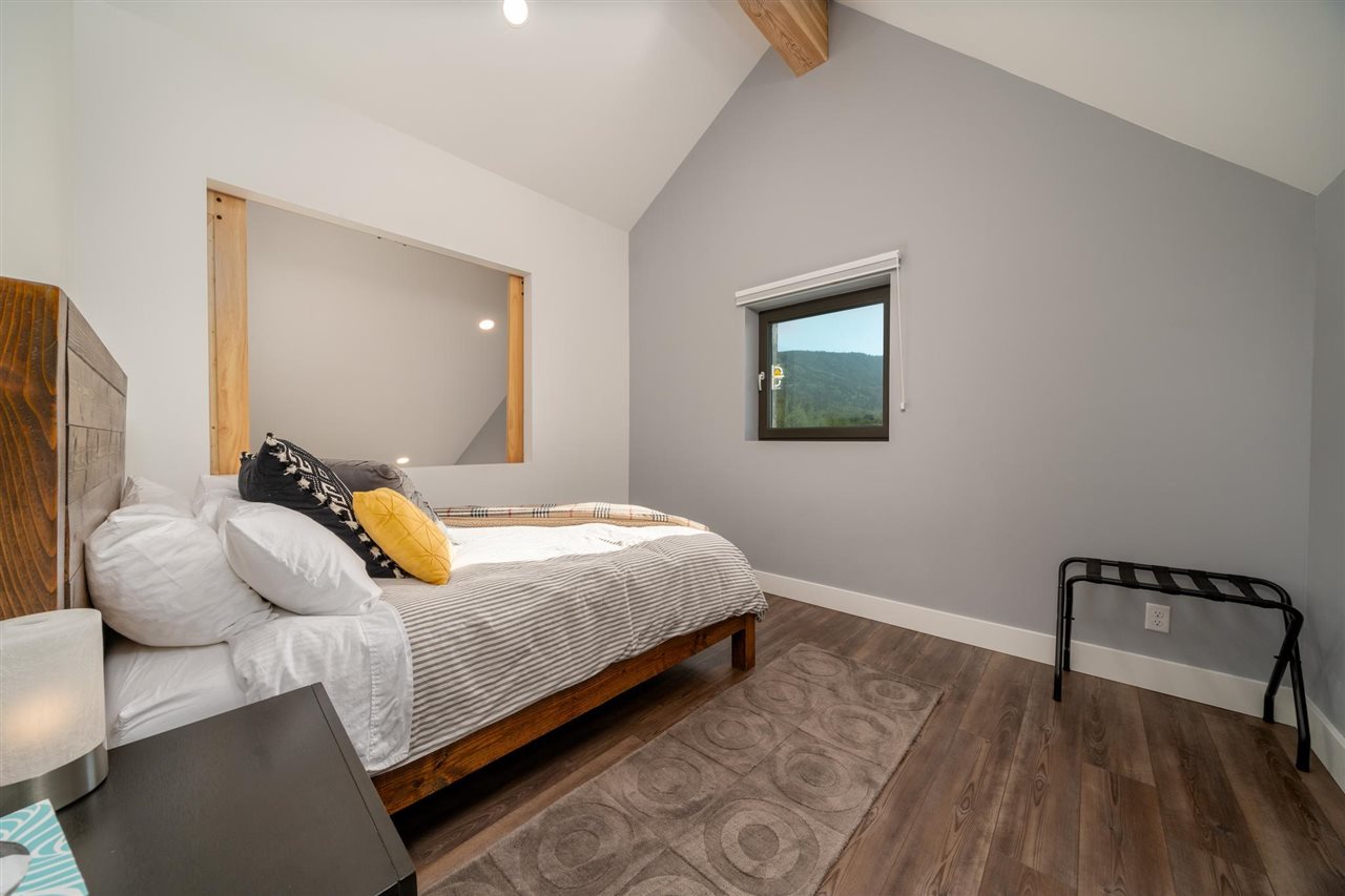 408 Coyote Run Mesa, CO 81643 - Photo 20 of 35 a bedroom with a bed and wooden floor