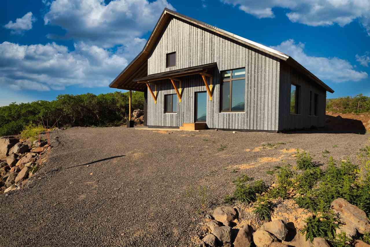 408 Coyote Run Mesa, CO 81643 - Photo 26 of 35 a view of a house with a yard