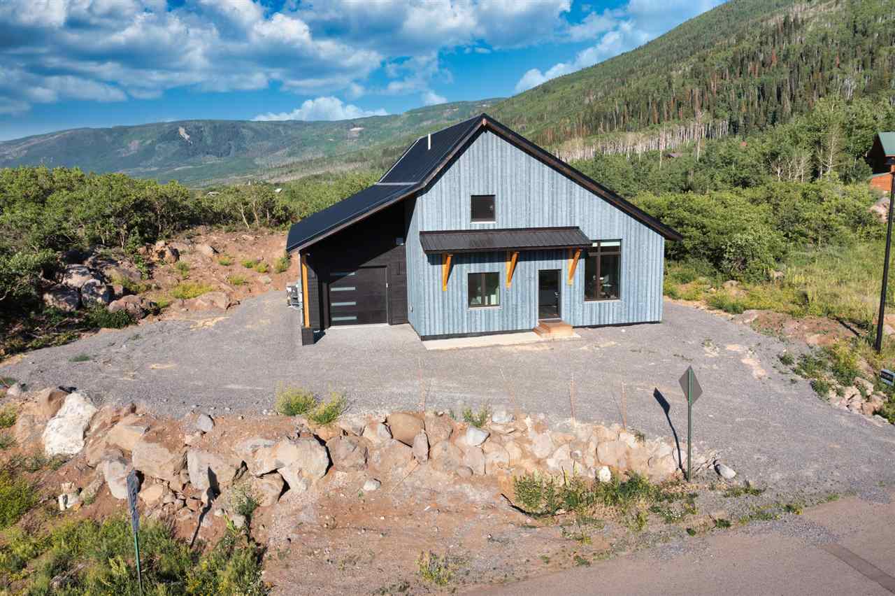 408 Coyote Run Mesa, CO 81643 - Photo 27 of 35 a view of a house with a yard