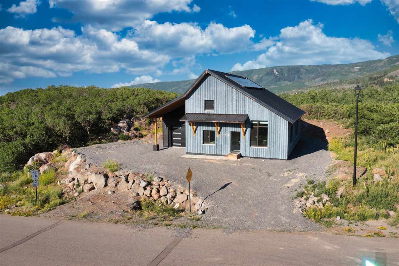 408 Coyote Run Mesa, CO 81643 - Photo 28 of 35 a front view of a house with a yard