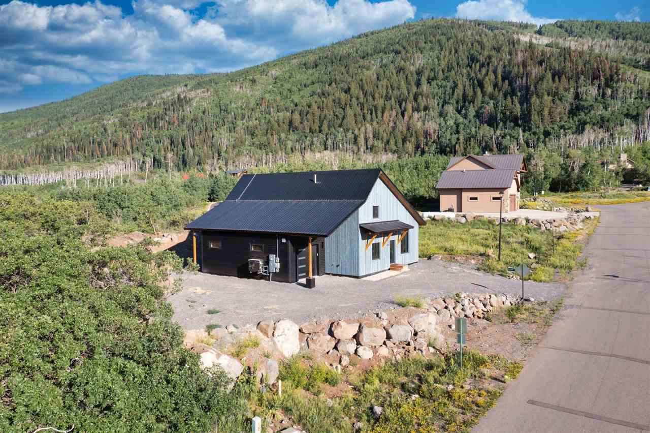 408 Coyote Run Mesa, CO 81643 - Photo 29 of 35 a front view of a house with a yard