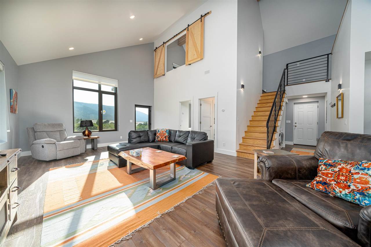 408 Coyote Run Mesa, CO 81643 - Photo 4 of 35 a living room with furniture and a flat screen tv