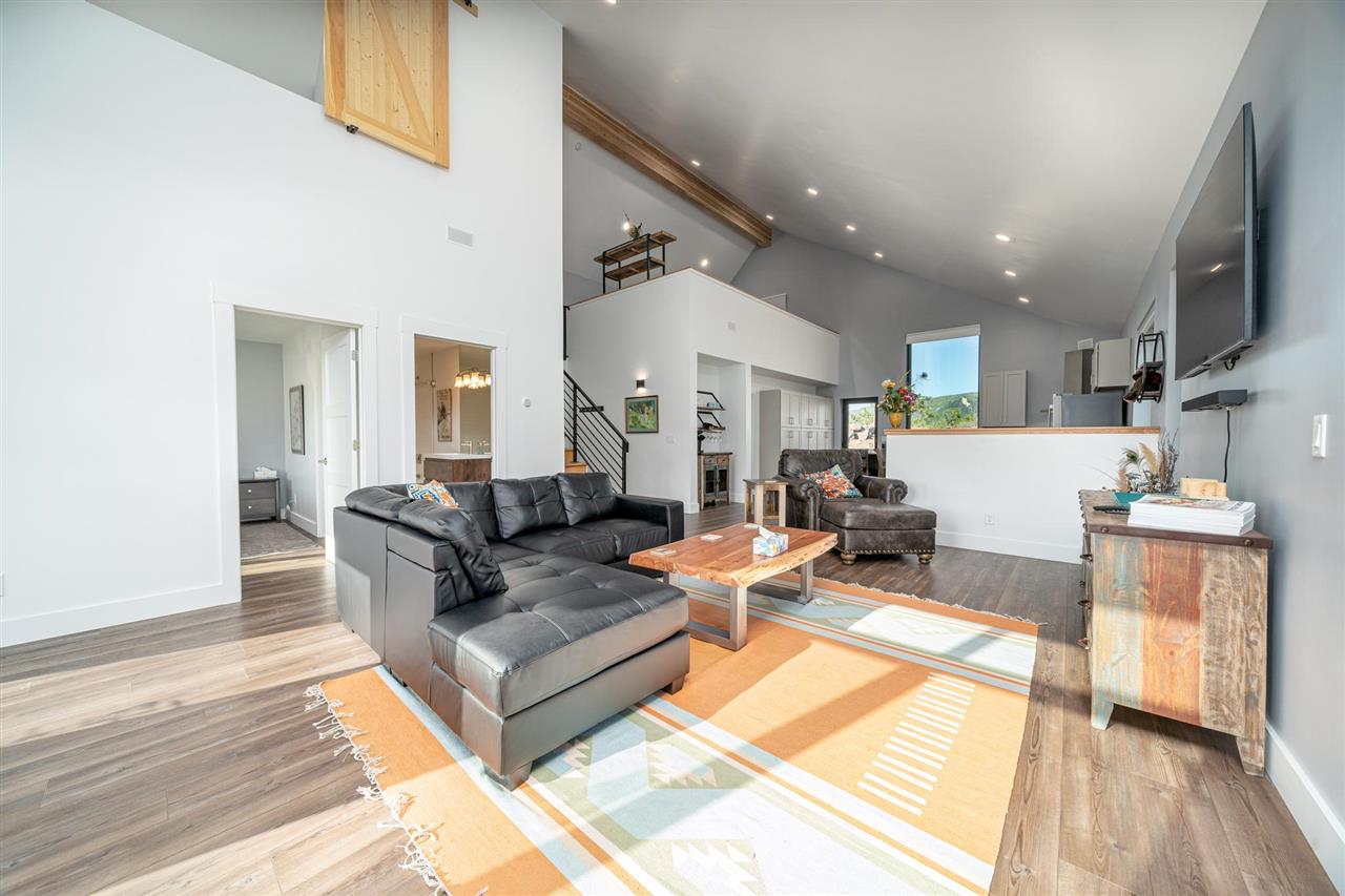 408 Coyote Run Mesa, CO 81643 - Photo 5 of 35 a living room with furniture and a wooden floor