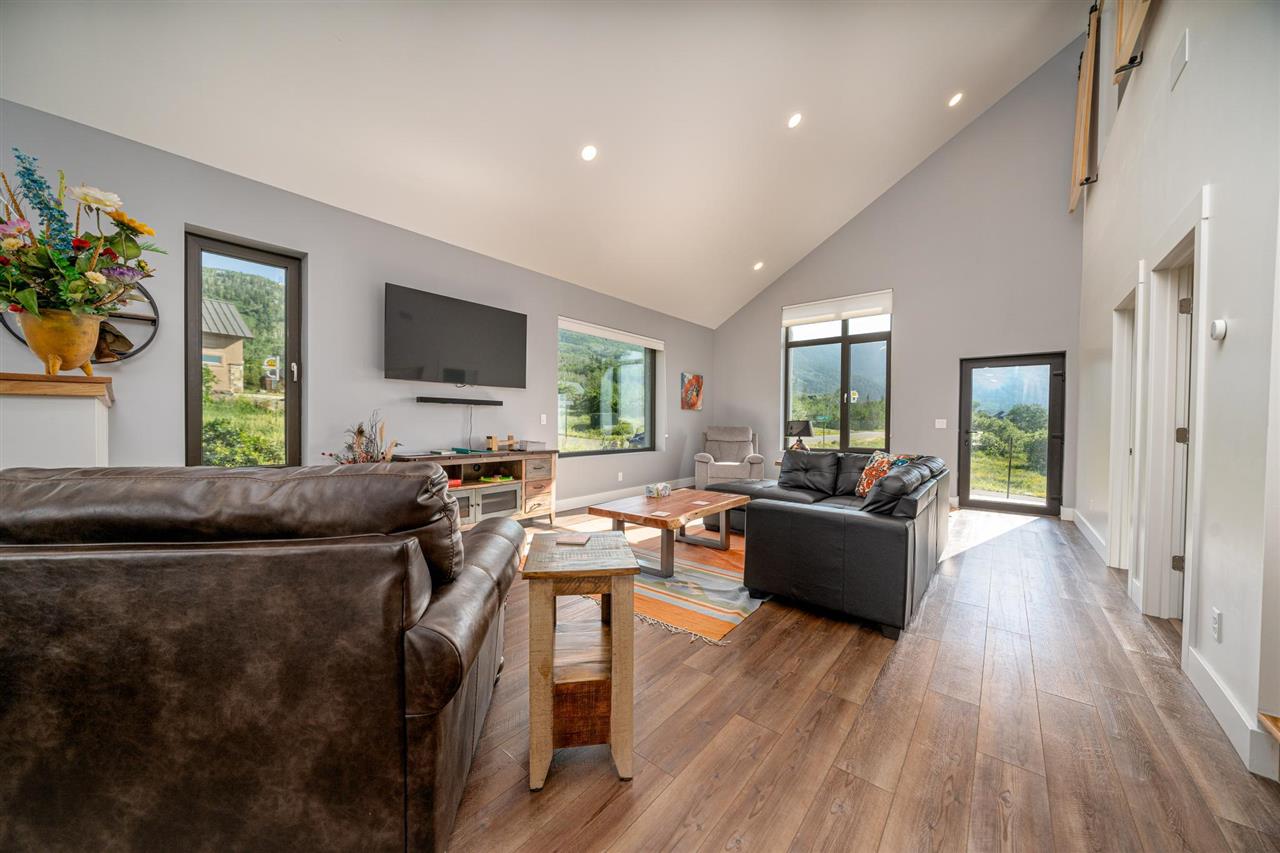 408 Coyote Run Mesa, CO 81643 - Photo 6 of 35 a living room with furniture and a flat screen tv