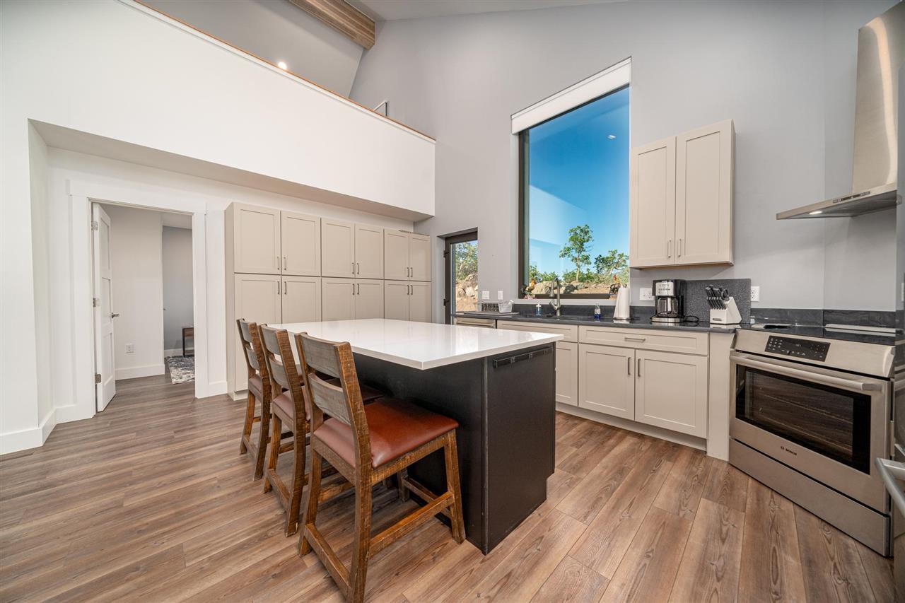408 Coyote Run Mesa, CO 81643 - Photo 7 of 35 a kitchen with a table chairs sink and cabinets