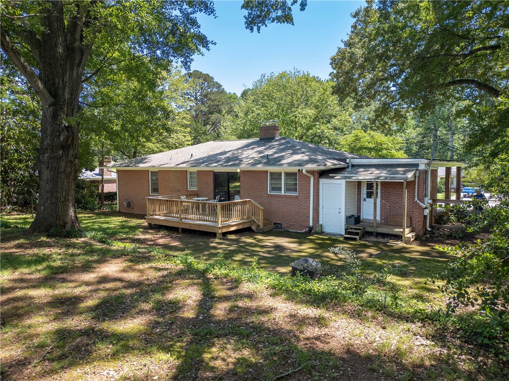 207 Brook Street Clemson, SC 29631 - Photo 39 of 39 A classic brick dwelling with a spacious wooden deck and shaded yard provides a private outdoor retreat.
