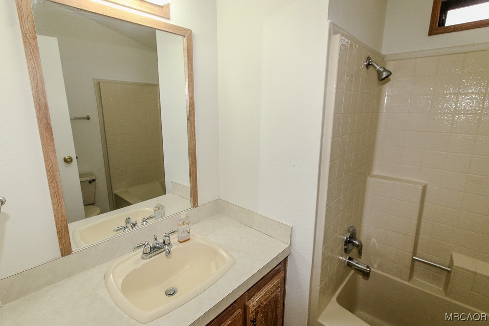 1197 Mitchell Lane Big Bear City, CA 92386 - Photo 18 of 32 a bathroom with a sink toilet and shower