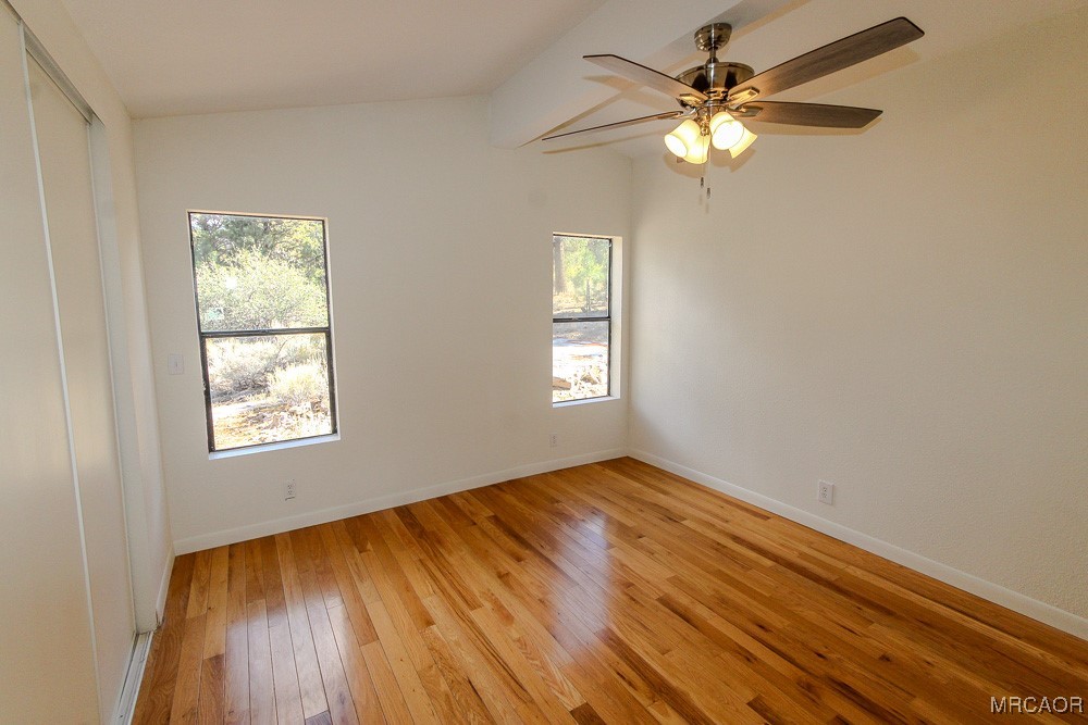 1197 Mitchell Lane Big Bear City, CA 92386 - Photo 21 of 32 a view of an empty room and window