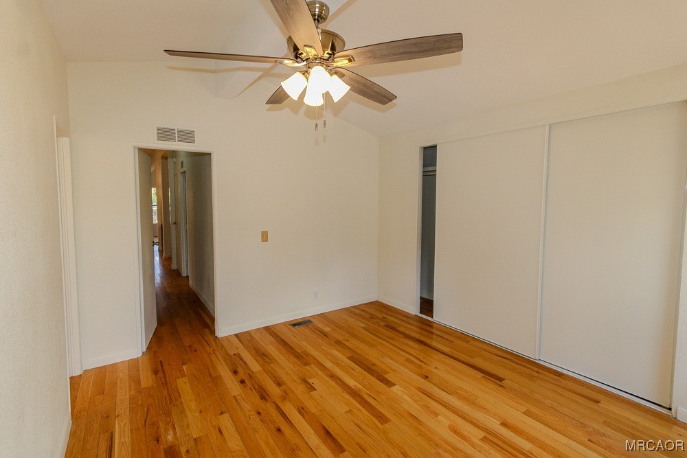 1197 Mitchell Lane Big Bear City, CA 92386 - Photo 23 of 32 a view of a bedroom with wooden floor