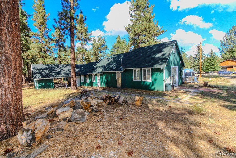 1197 Mitchell Lane Big Bear City, CA 92386 - Photo 26 of 32 a view of a house with a yard