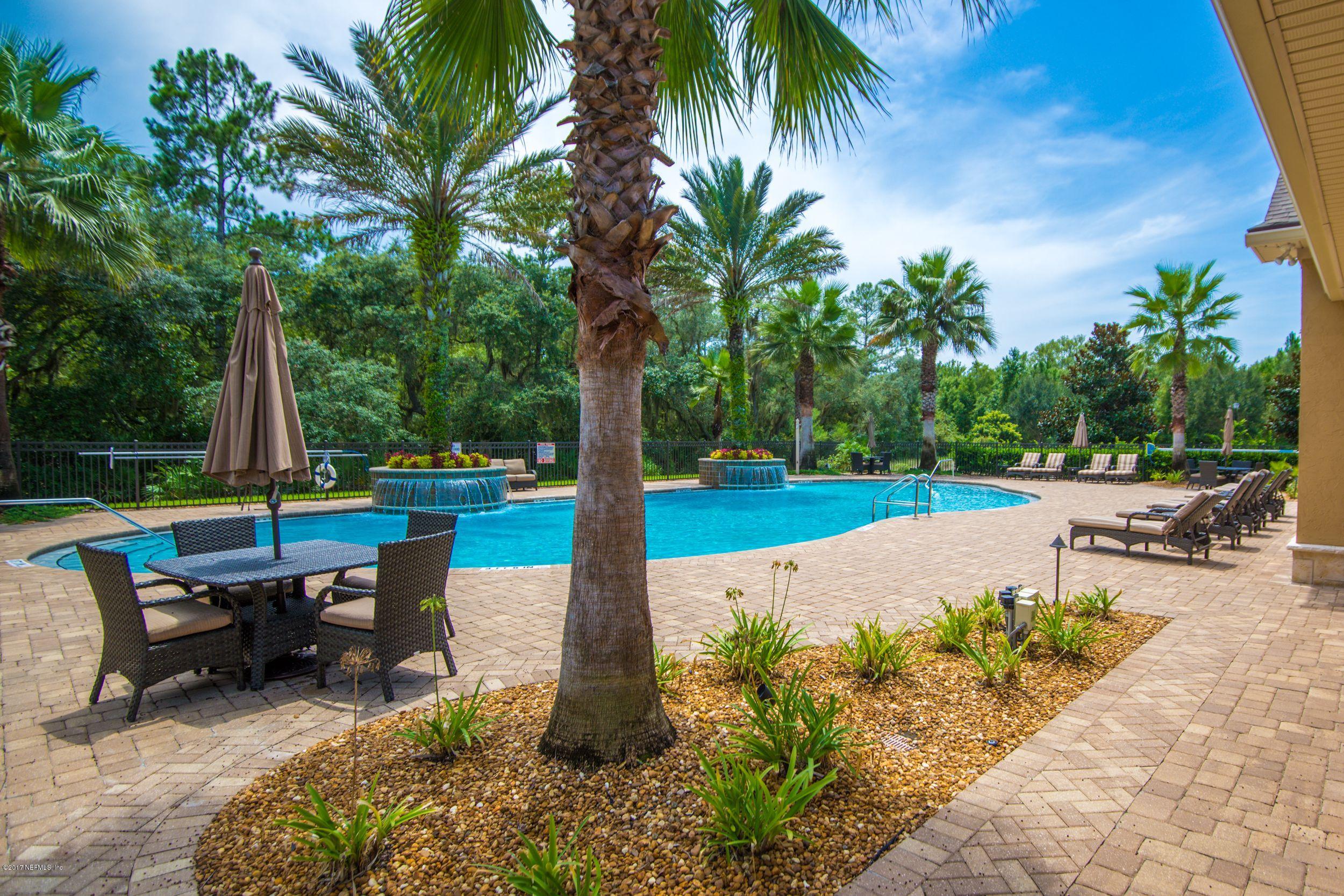 84 Ocale Court St. Augustine, FL 32084 - Photo 16 of 21 a view of a backyard with swimming pool and sitting area