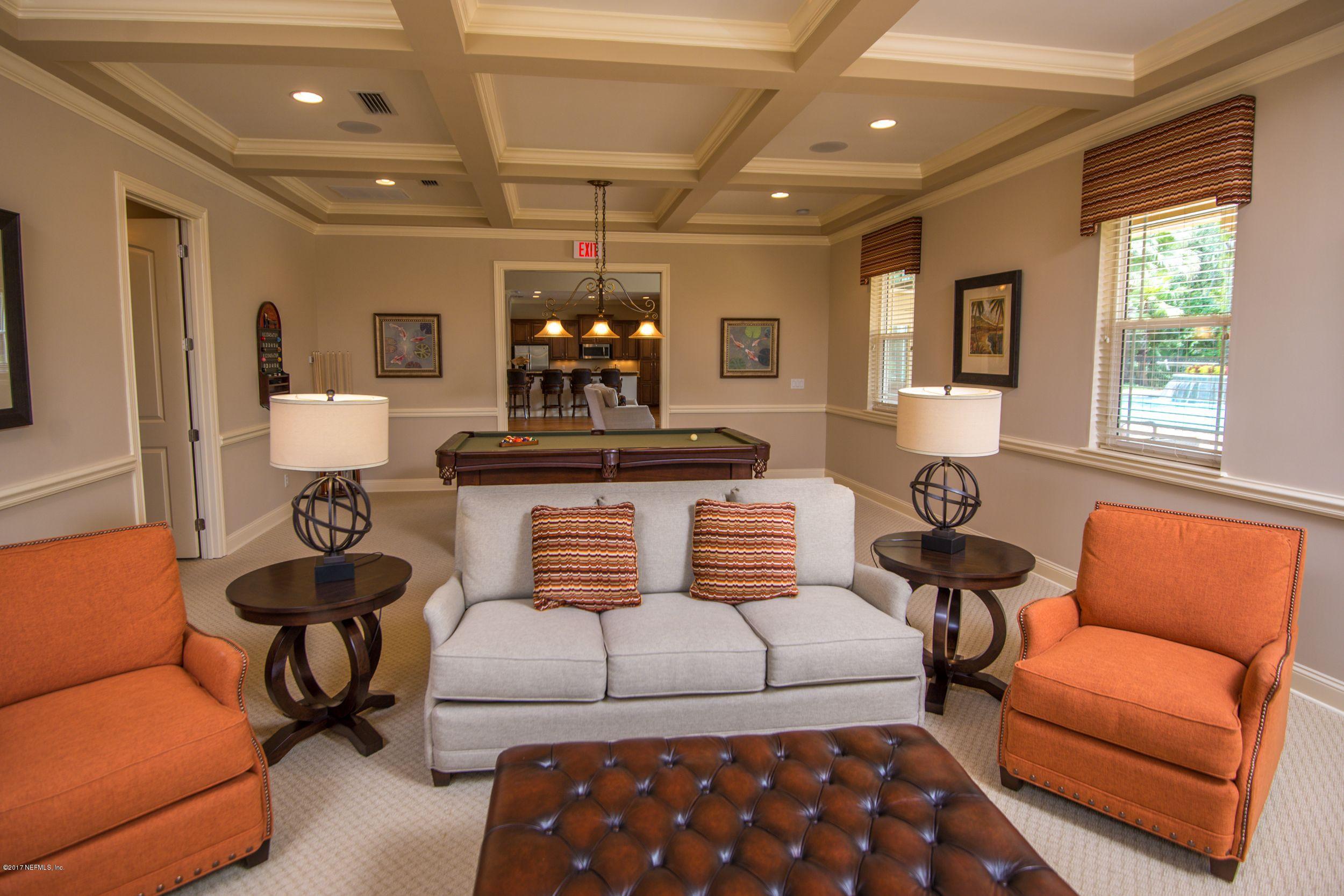 84 Ocale Court St. Augustine, FL 32084 - Photo 19 of 21 a living room with furniture a flat screen tv and a window
