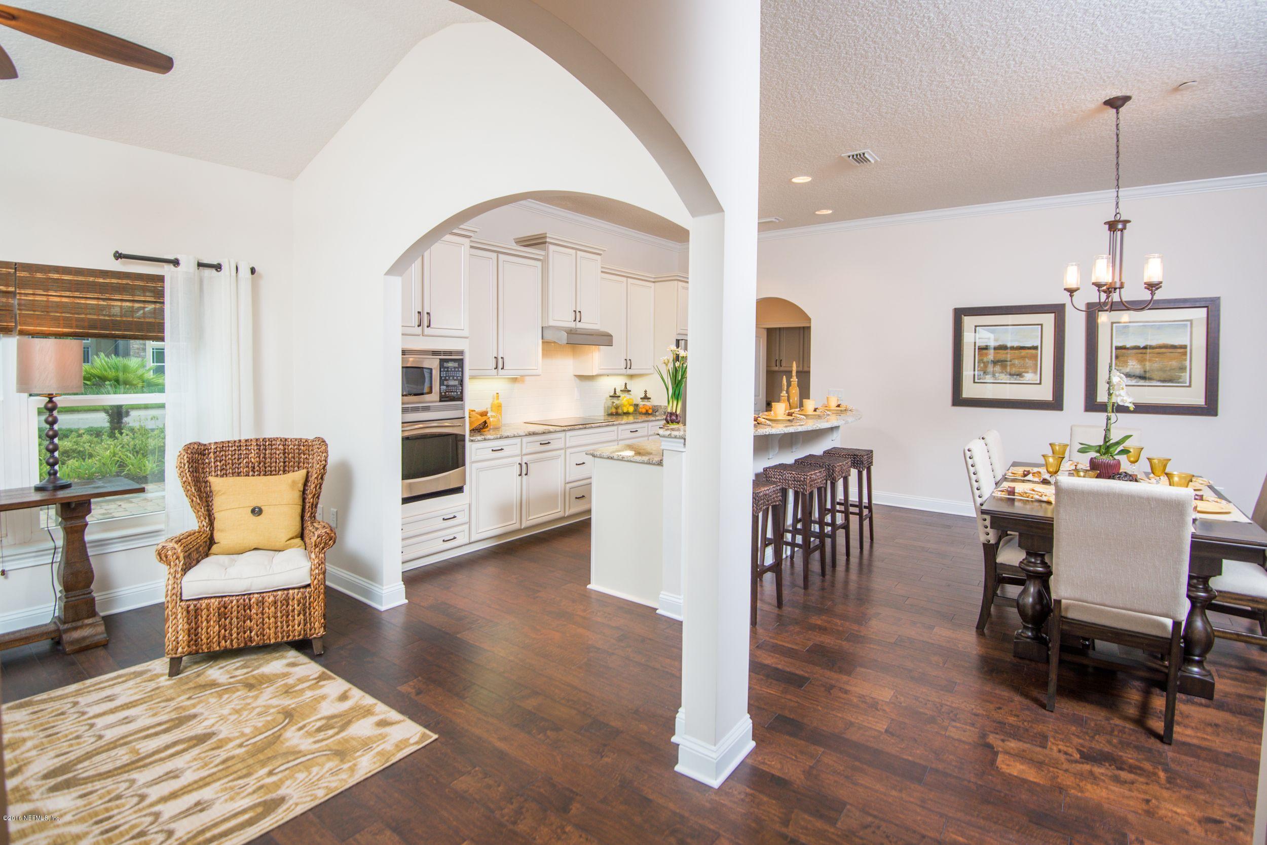 84 Ocale Court St. Augustine, FL 32084 - Photo 3 of 21 a living room with furniture and a dining table with wooden floor