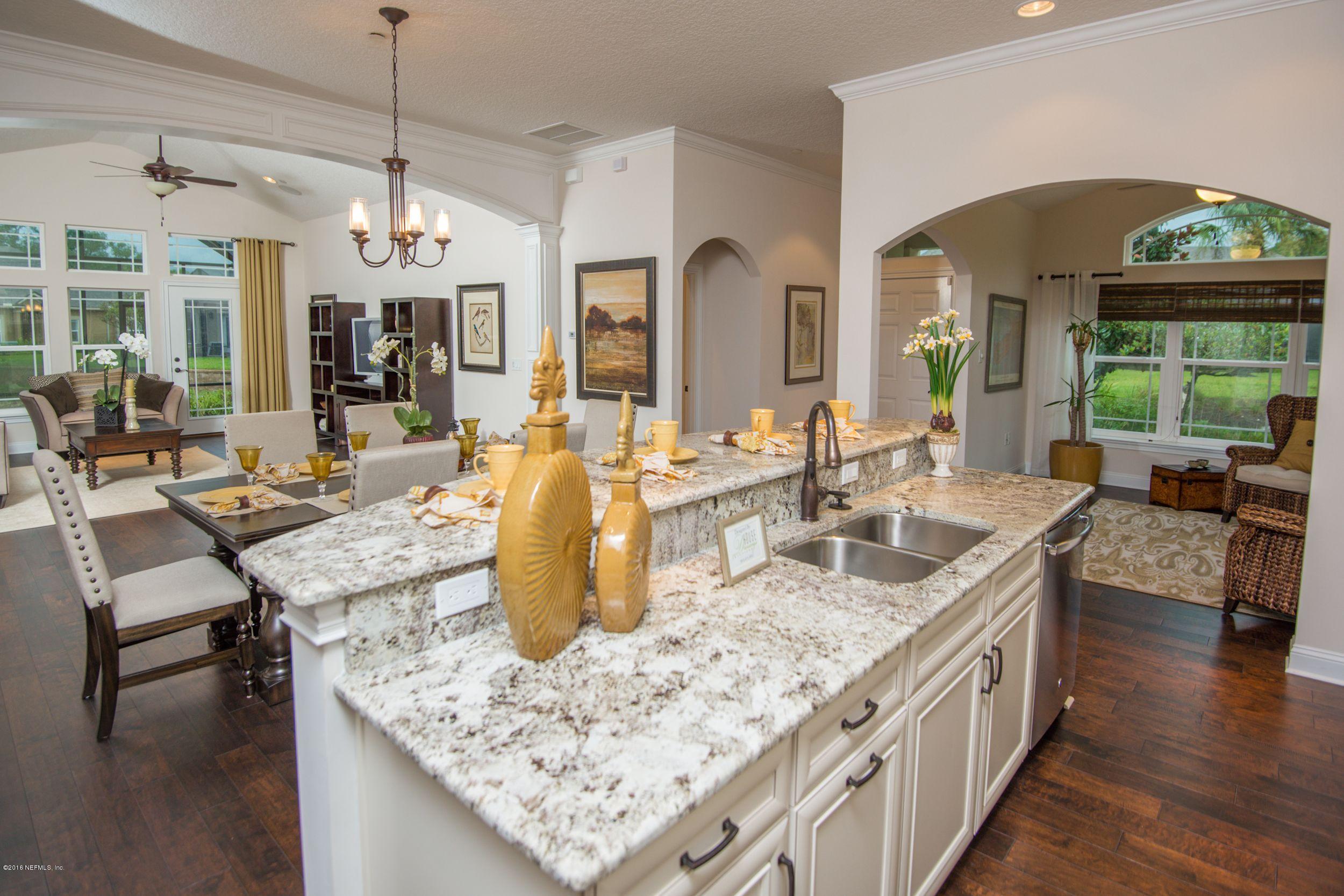 84 Ocale Court St. Augustine, FL 32084 - Photo 6 of 21 a kitchen with center island table and chairs