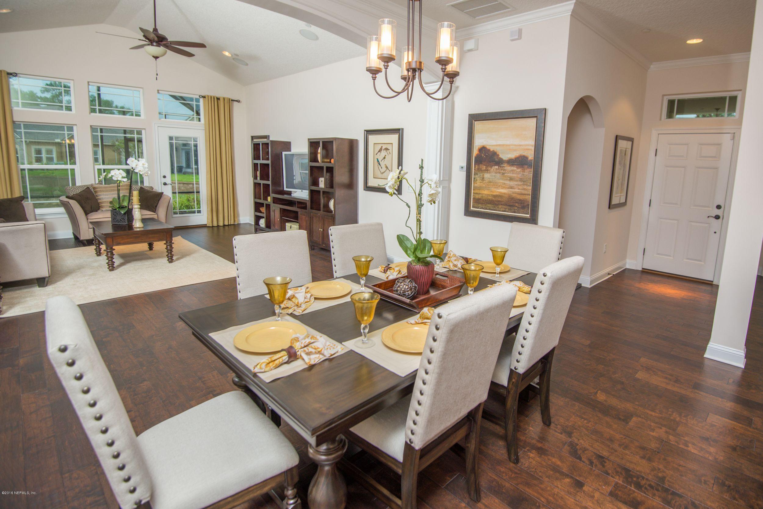 84 Ocale Court St. Augustine, FL 32084 - Photo 7 of 21 a view of a dining room with furniture wooden floor and chandelier