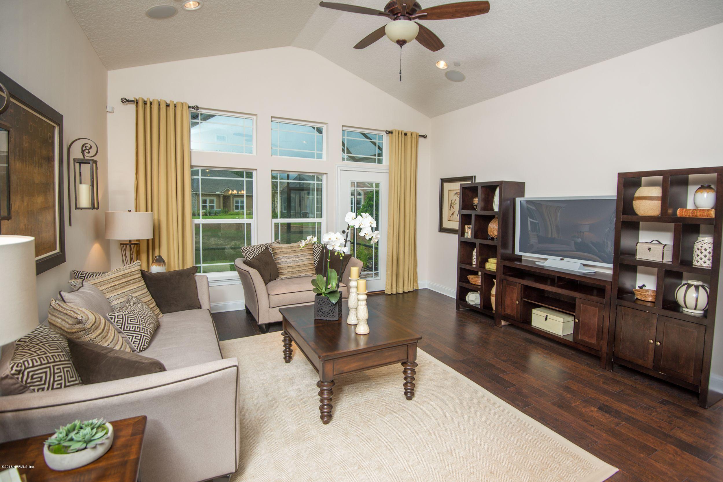84 Ocale Court St. Augustine, FL 32084 - Photo 8 of 21 a living room with furniture and a flat screen tv