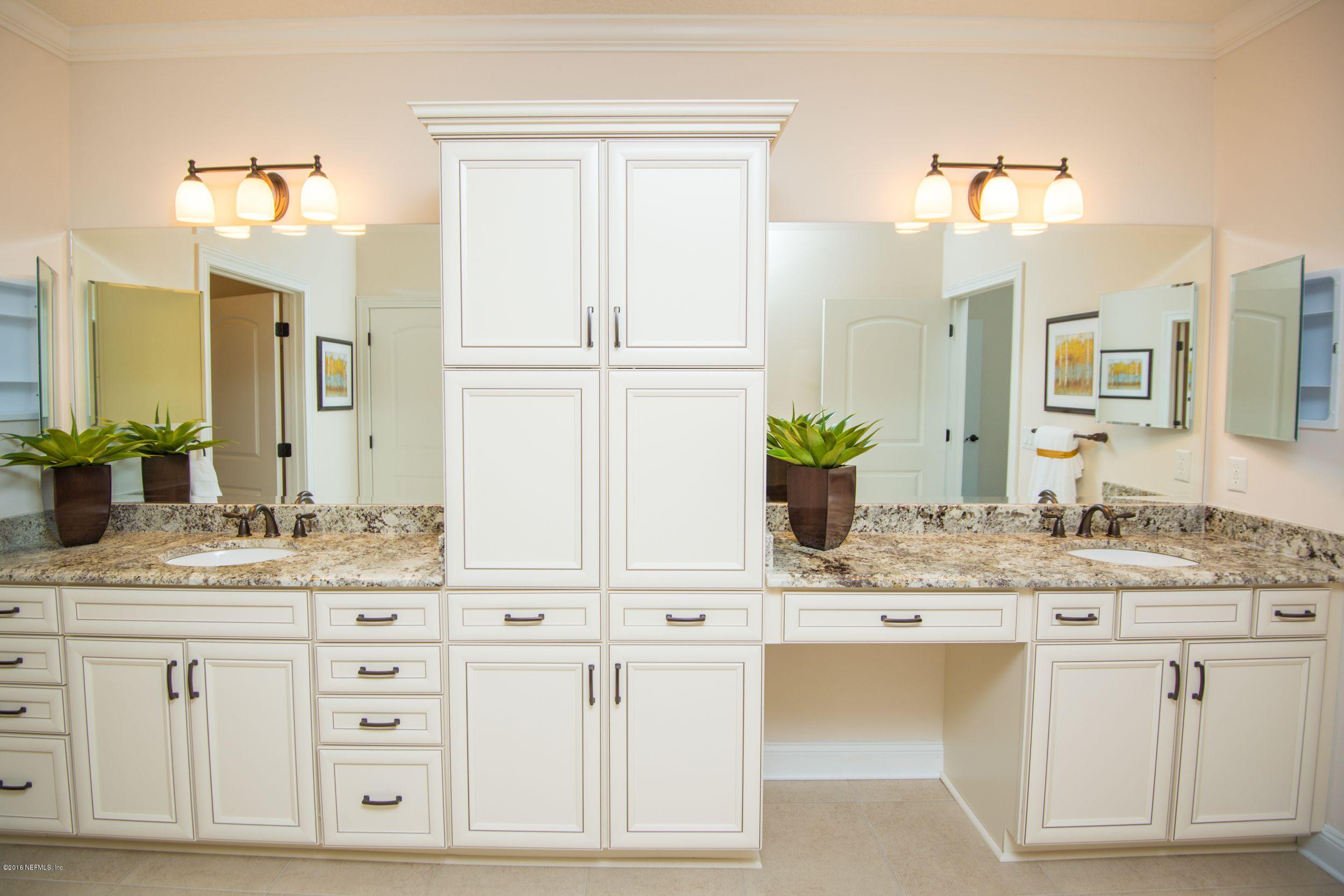 84 Ocale Court St. Augustine, FL 32084 - Photo 10 of 21 a bathroom with a granite countertop sink and a mirror