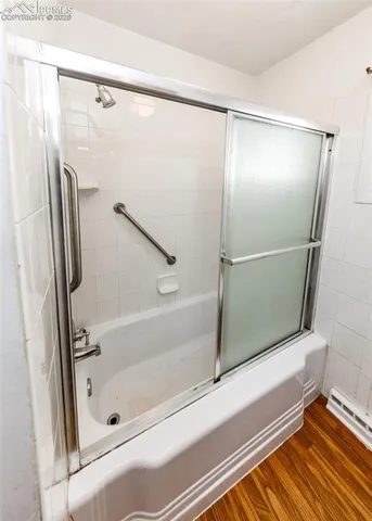 a bathroom with a bathtub and a shower
