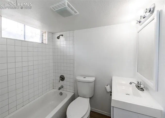 a bathroom with a toilet sink and bathtub