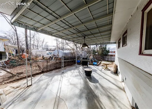 a view of a backyard with sitting area