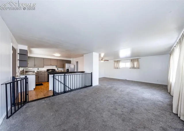 a view of a kitchen with lots of counter top space