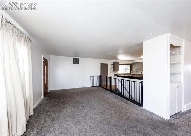 a view of a livingroom with a staircase