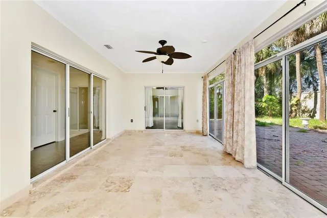 a view of an empty room with windows