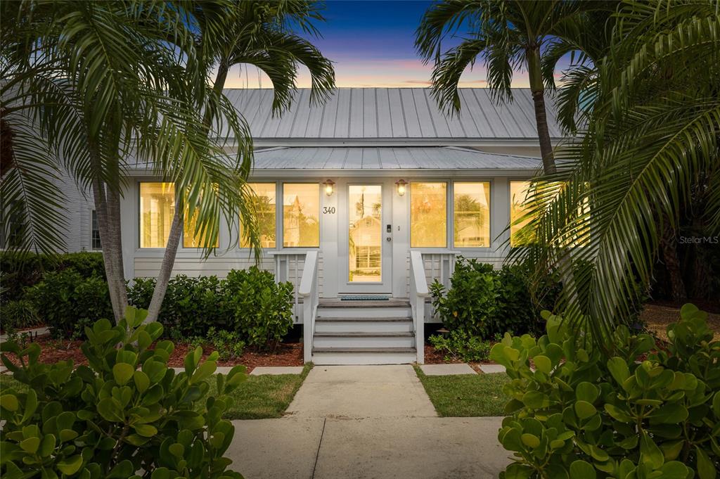 340 Palm Avenue Boca Grande, FL 33921 - Photo 2 of 38 a view of a house with a yard