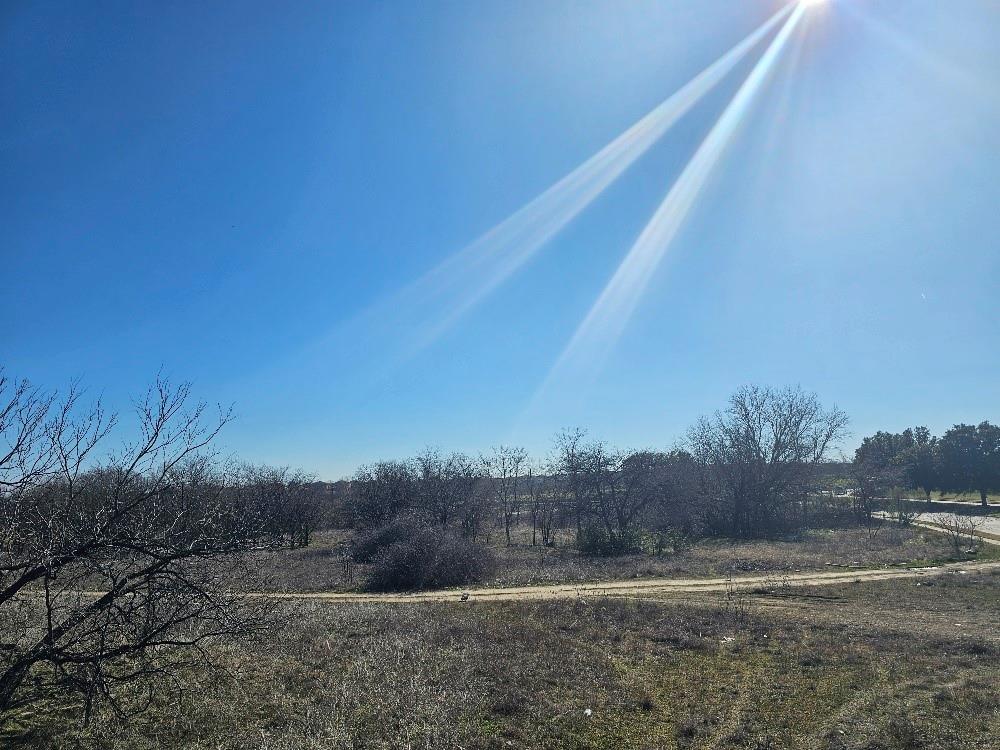 3206 Northwest 820th Loop Fort Worth, TX 76135 - Photo 10 of 15 a view of a dry yard with trees