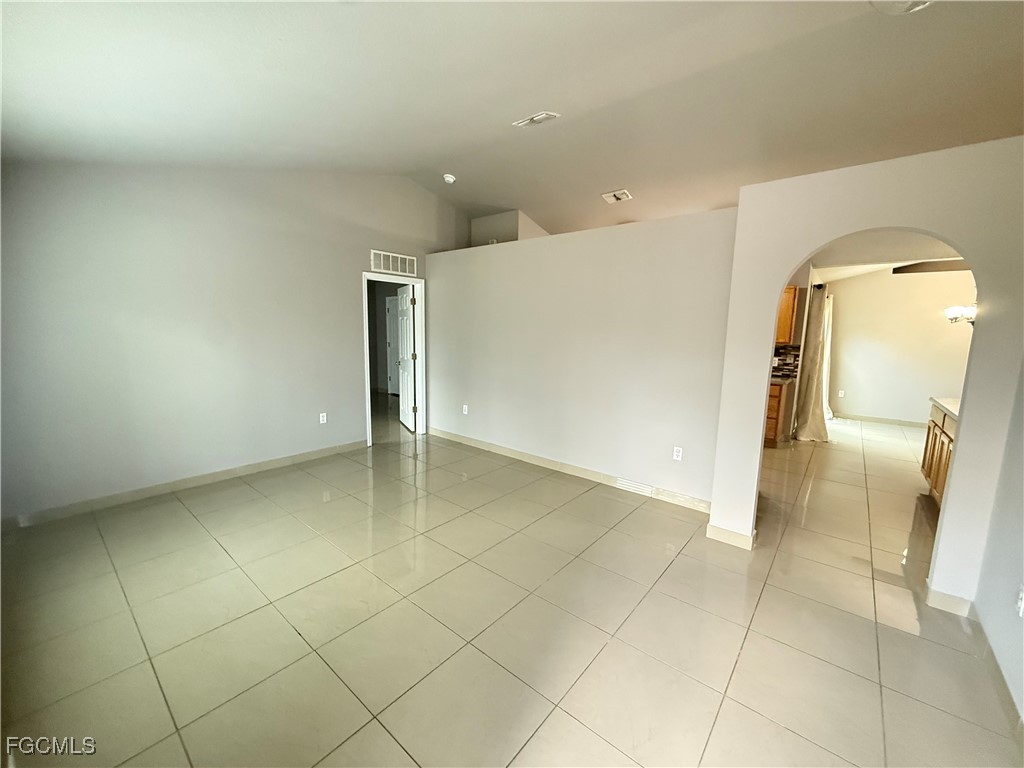 3207 54th Street West Lehigh Acres, FL 33971 - Photo 2 of 13 a view of a livingroom with wooden floor
