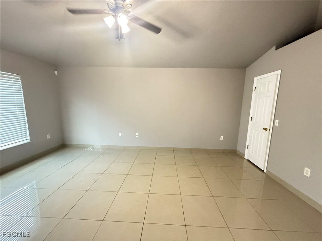 3207 54th Street West Lehigh Acres, FL 33971 - Photo 5 of 13 a view of an empty room with a window