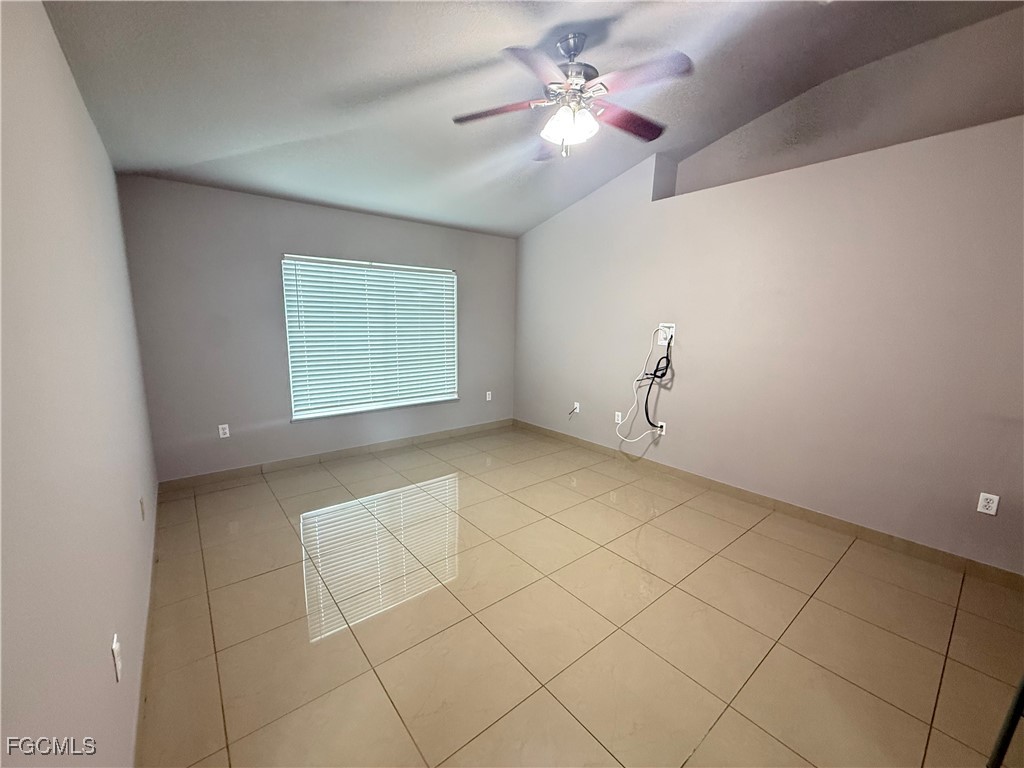 3207 54th Street West Lehigh Acres, FL 33971 - Photo 7 of 13 a view of an empty room with a window