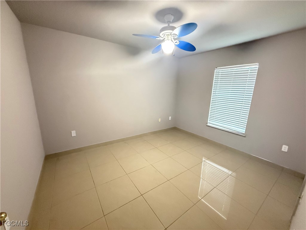 3207 54th Street West Lehigh Acres, FL 33971 - Photo 10 of 13 a view of an empty room with a window