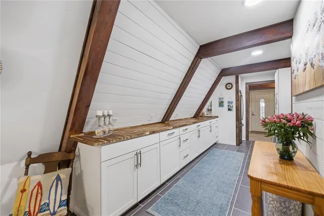 a room with lot of cabinets and wooden floor