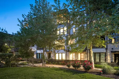 a large kitchen with stainless steel appliances kitchen island a large counter tops and a sink