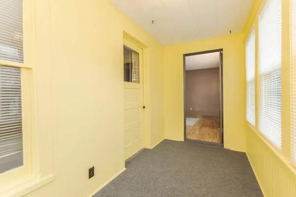 a view of a bathroom from a hallway
