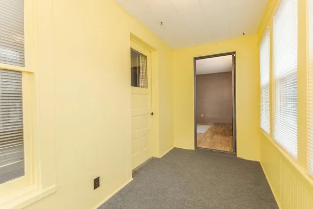 a view of a bathroom from a hallway