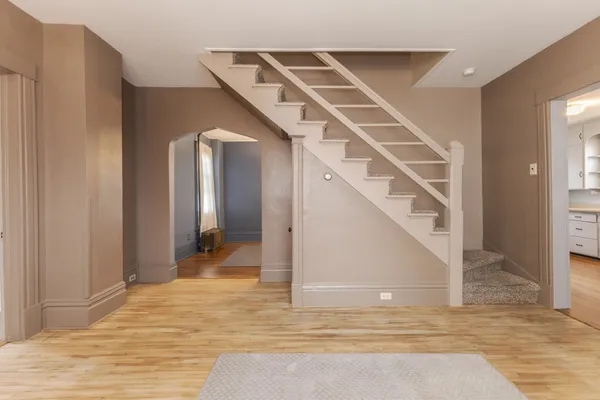 a view of a hallway view with staircase