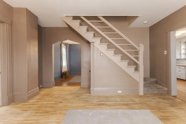 a view of a hallway view with staircase