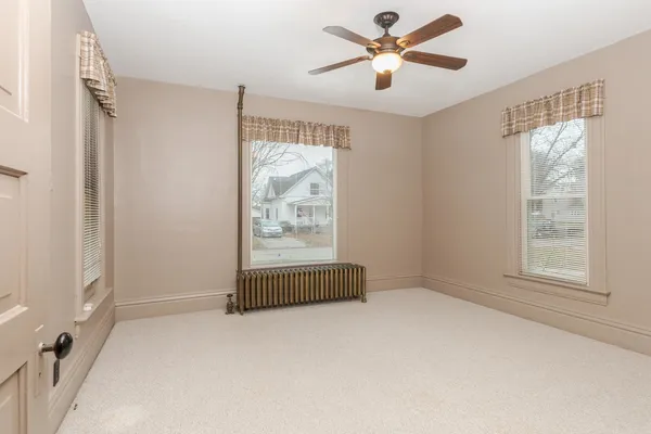 a view of workspace with window and ceiling fan