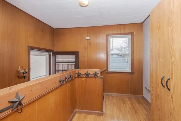a view of a door and wooden floor