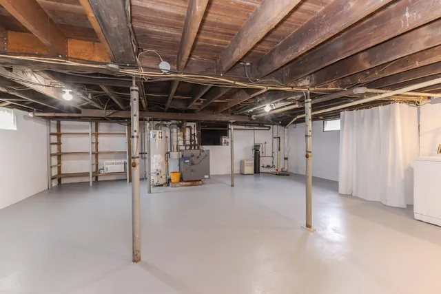 a view of empty room with wooden ceiling
