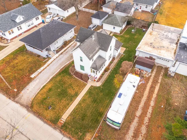 an aerial view of a house with swimming pool