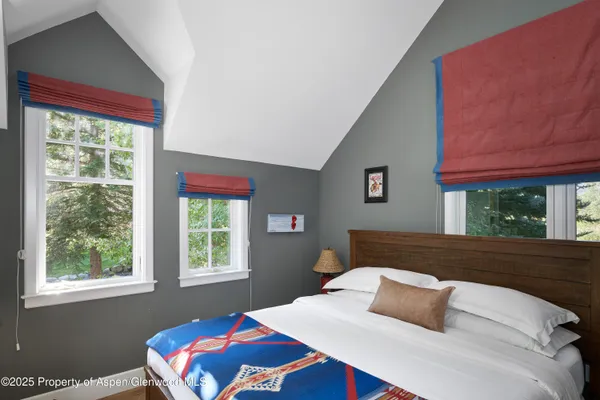 a view of a lake with a house in the background