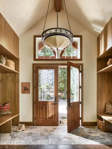 a very nice looking dining room with a large glass table and chairs